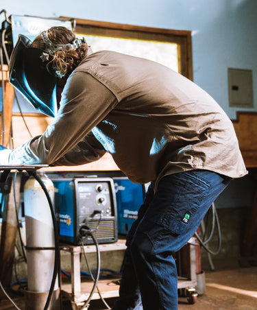 Guy working in the FXD long sleeve work shirt