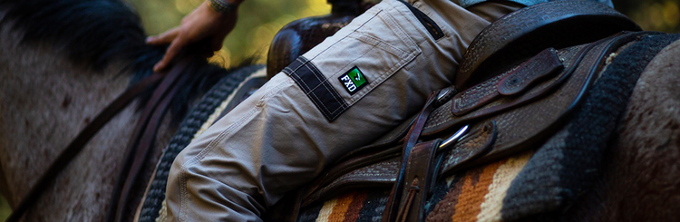 Man wearing FXD pants while riding a horse