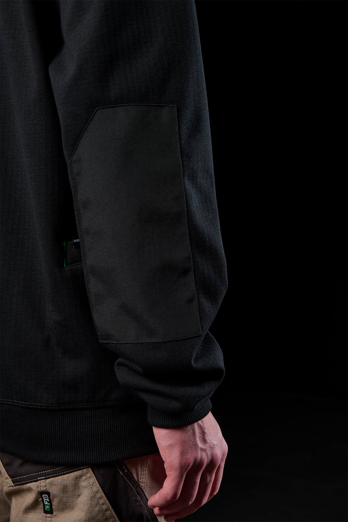 WF-3 sleeve close-up showing a DURA500 patch on reinforced pocket