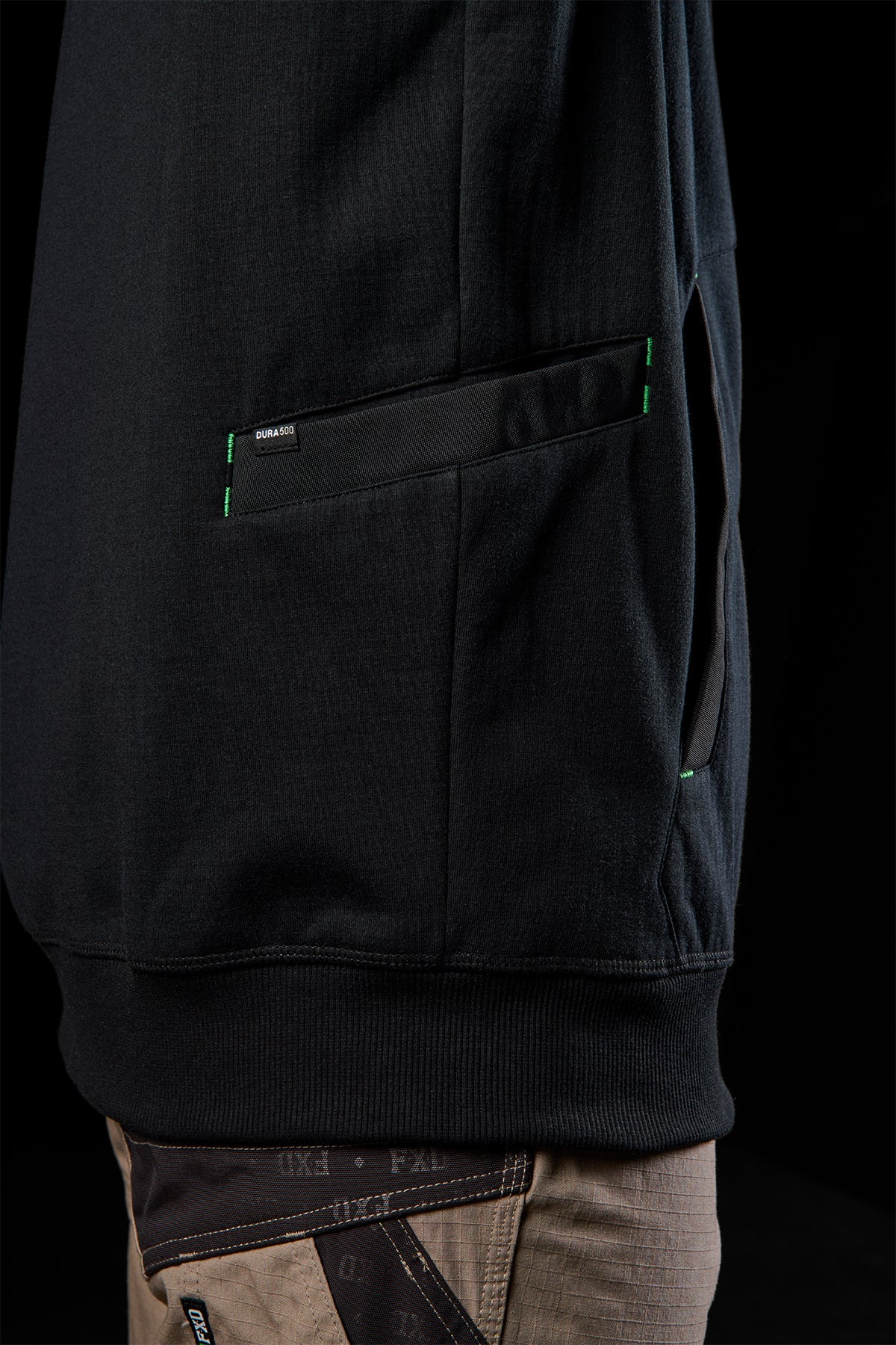 WF-3 sleeve side view featuring reinforced pocket with green contrast stitching
