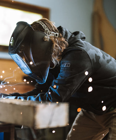 welder wearing WF1 Work Fleece hoodie