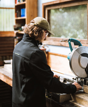 Wood worker wearing the FXD soft shell work jacket WO.3