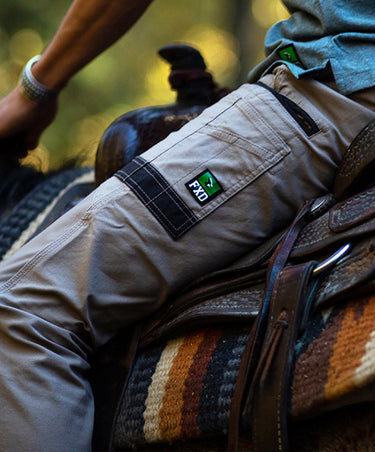 Man wearing FXD pants while riding a horse 